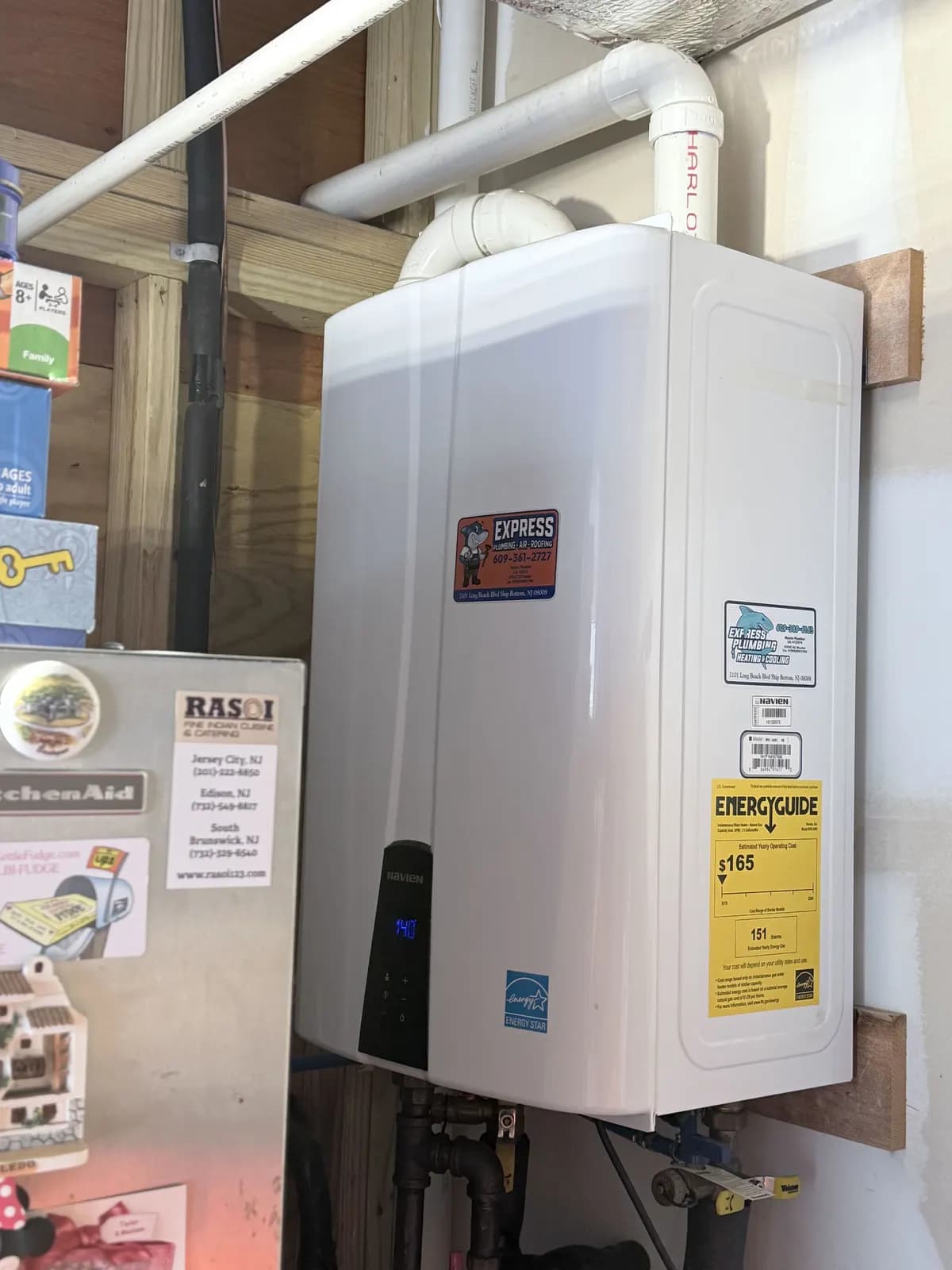 Express Plumbing tankless water heater installed in a New Jersey home's utility space